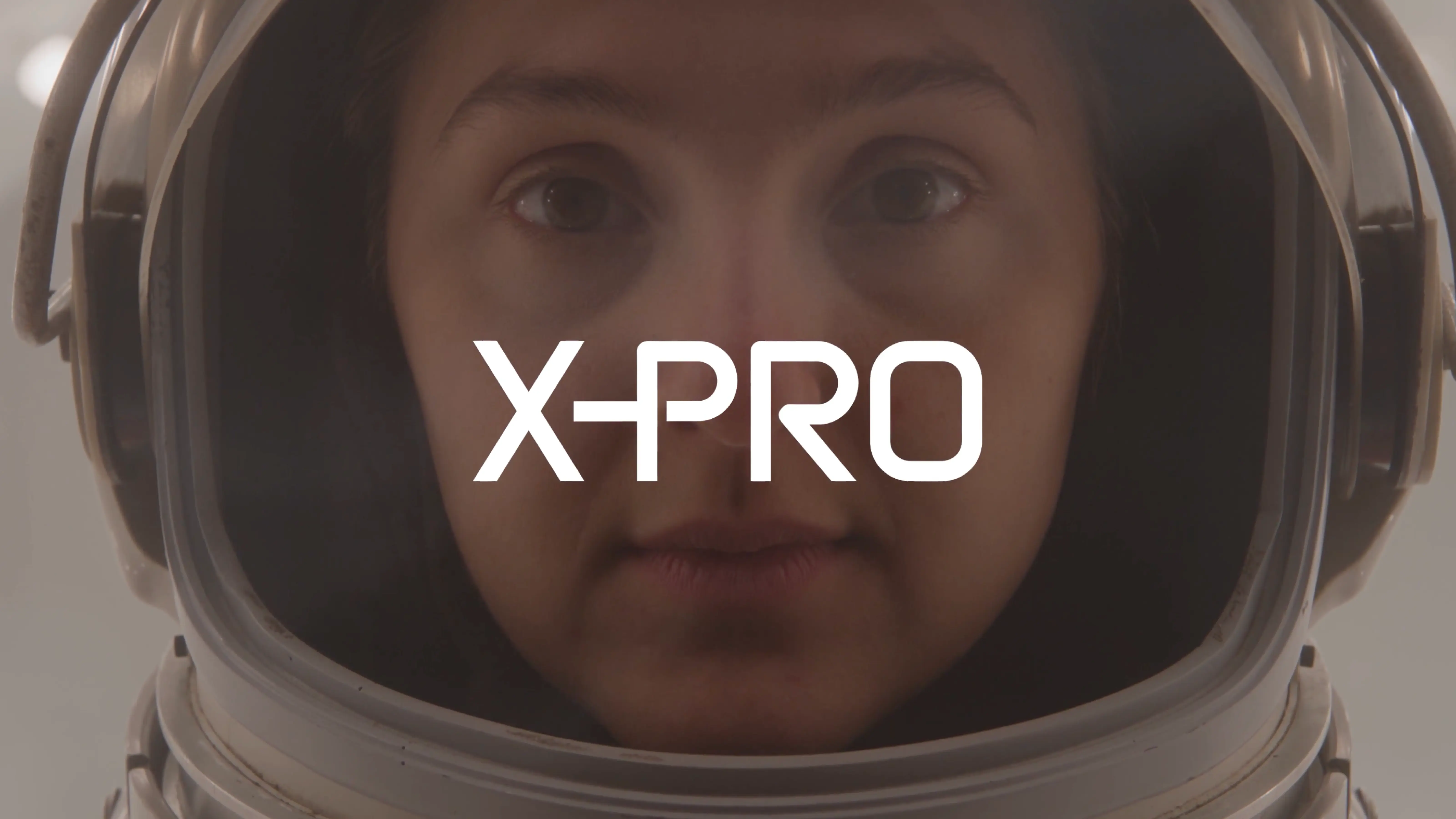 MarketAxess X-Pro title card: an astronaut helmet reflecting the trade screen, the X-PRO wordmark overlaid